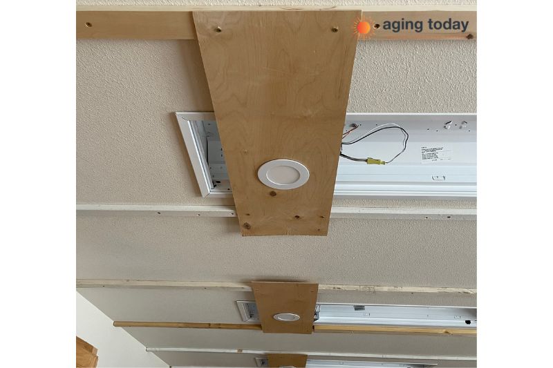 A smart lighting project in the kitchen, during the project, new lighting being measured and installed.